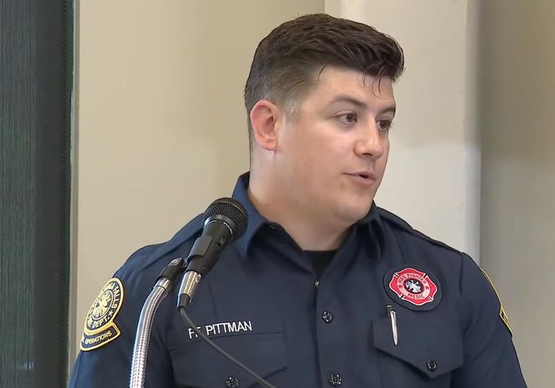 Cuyahoga Falls firefighter Daniel Pittman speaks at a press conference updating the recovery effort to find the missing father who went into the Cuyahoga River on June 21.
