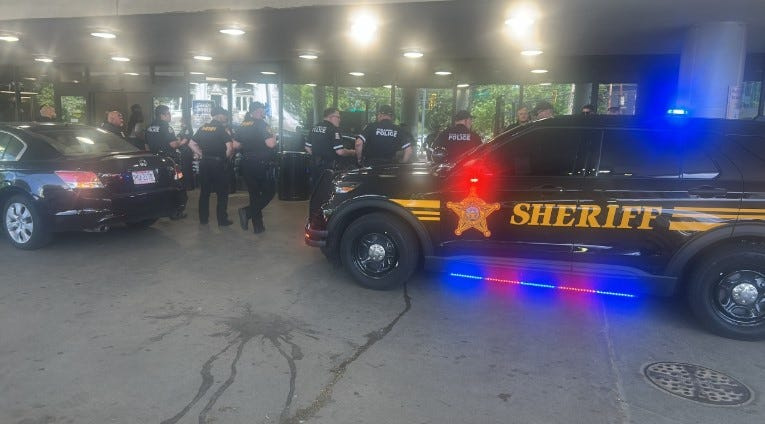 Mifflin Township police, Franklin County Sheriff's deputies and other law enforcement agencies gather outside OhioHealth Grant Medical Center in downtown Columbus to applaud the release of the second of two Mifflin Township police officers being released from the hospital. Both were taken there with gunshot injuries after being shot by 21-year-old Daveonte Dixon after Dixon fled a traffic stop in late May.
