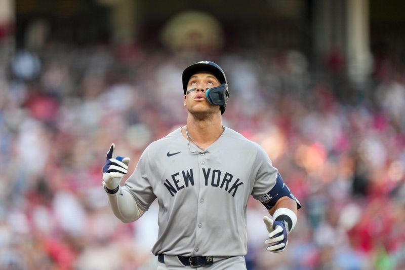 New York Yankees outfielder Aaron Judge (99) crosses the plate on a solo home run in the first inning of the MLB interleague game between the Cincinnati Reds and the New York Yankees at Great American Ball Park in downtown Cincinnati on Monday, June 23, 2025.