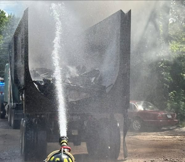 Water is hosed onto the back of a tractor trailer after it caught fire on State Route 14 in Streetsboro June 24.