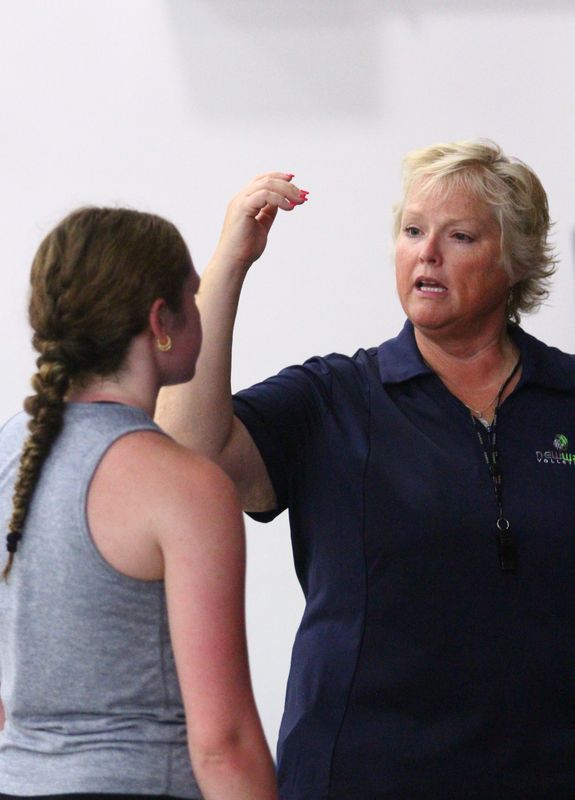 Director Jeri Helfer instructs Newark freshman Khaia Grove during the New Wave Volleyball camp at the Buckeye Valley Family YMCA in Newark on June 24, 2025.