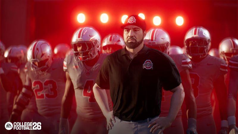 Ohio State coach Ryan Day leads Ohio State out of the tunnel. Real life coaches will be in EA Sports College Football 26 for the first time.