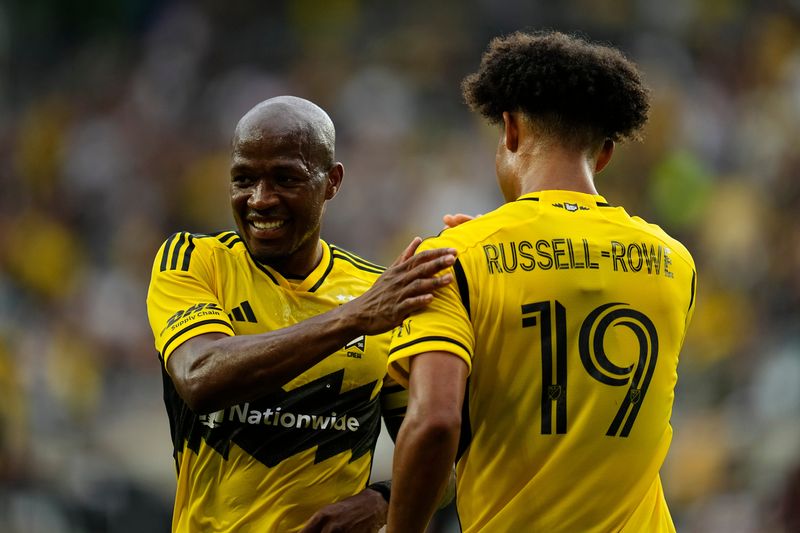 Columbus Crew midfielder Darlington Nagbe (6) celebrates a goal by forward Jacen Russell-Rowe (19) during the first half of the MLS match against Atlanta United at Lower.com Field on June 25, 2025.