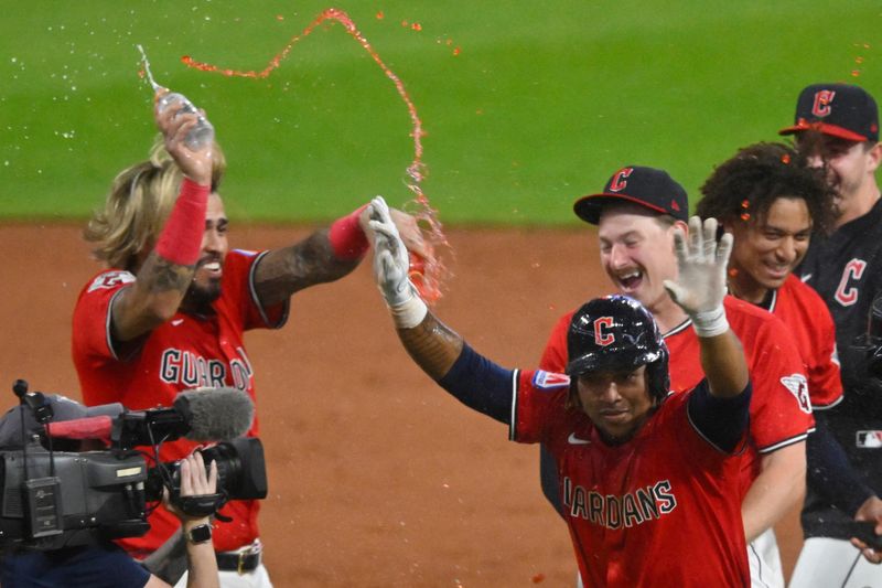 The Cleveland Guardians celebrate a game-winning single by Jose Ramirez (front right) in the 10th inning against the Toronto Blue Jays on June 25, 2025, in Cleveland, Ohio.