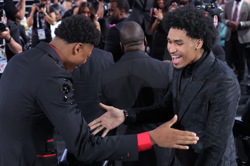 Dylan Harper celebrates with Ace Bailey after being selected by the San Antonio Spurs with the second pick in the draft.