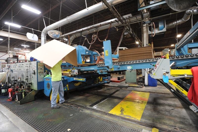 In 2012, an employee works at one of the lines in where corrugated containers are manufactured at the Marion plant of International Paper, 1600 Cascade Drive. The company annouced June 26 that it is closing its Marion operation.