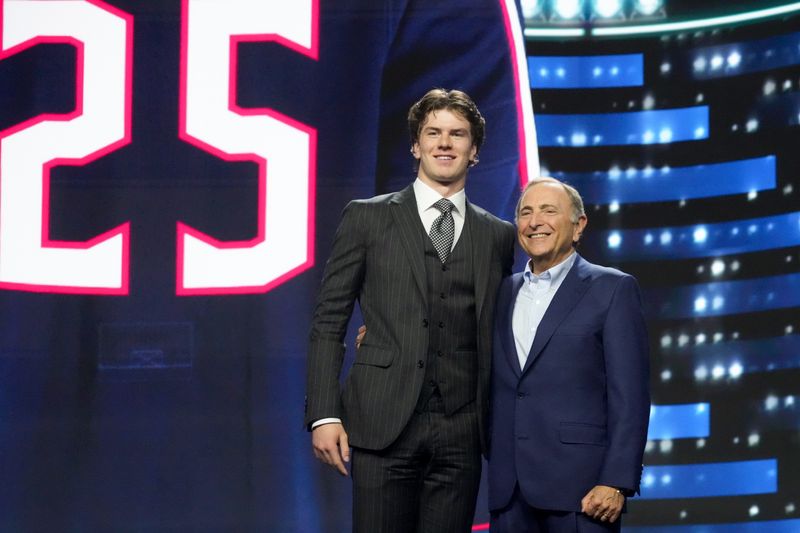 Blue Jackets prospect Jackson Smith takes the stage after being selected with the No. 14 overall pick in the 2025 NHL Draft.