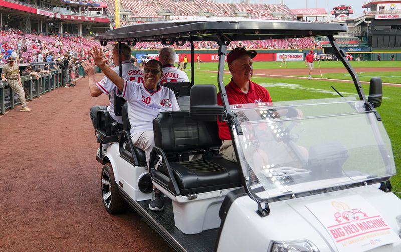 Former Cincinnati Reds player Tony Perez waves to fans during the Big Red Machine parade at Great American Ball Park in 2025.