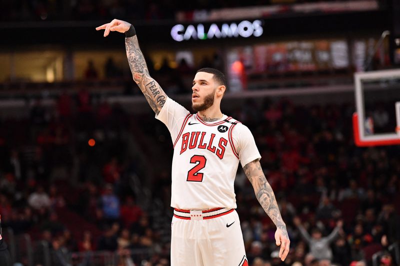 Feb 28, 2025; Chicago, Illinois, USA; Chicago Bulls forward Lonzo Ball (2) hits a three point shot against Toronto Raptors guard Jamal Shead (23) during overtime at the United Center. Mandatory Credit: Patrick Gorski-Imagn Images