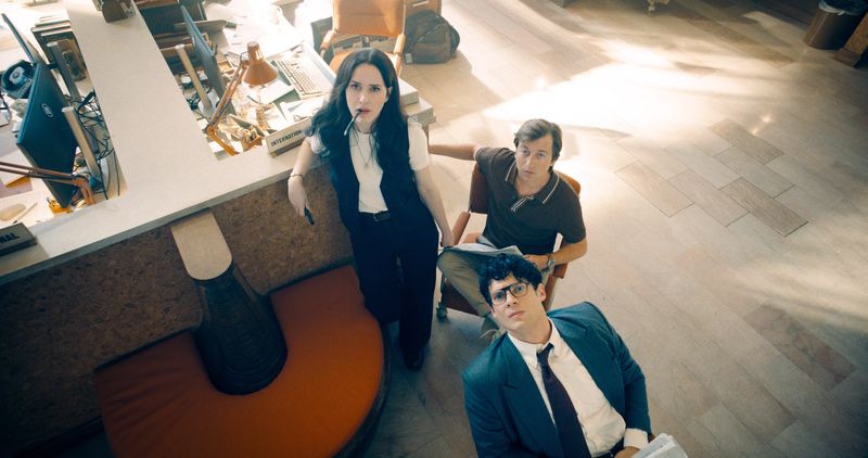 Daily Planet journalists Lois Lane (Rachel Brosnahan far left), Jimmy Olsen (Skyler Gisondo) and Clark Kent (David Corenswet) keep an eye on the TV in "Superman."