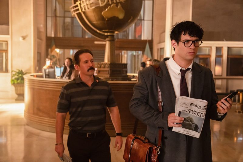 Daily Planet sports guy Steve Lombard (Beck Bennett, left) lobs a playful jab at Clark Kent (David Corenswet) in "Superman."