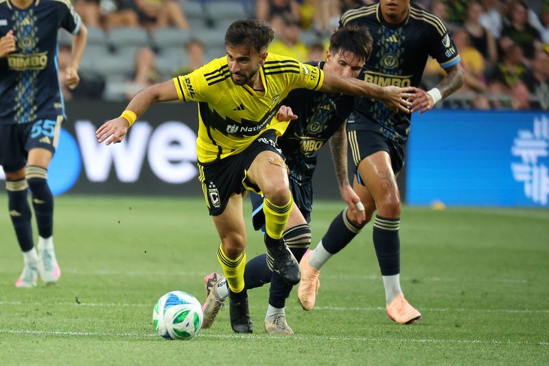 Crew forward Diego Rossi fights for the ball on June 29.