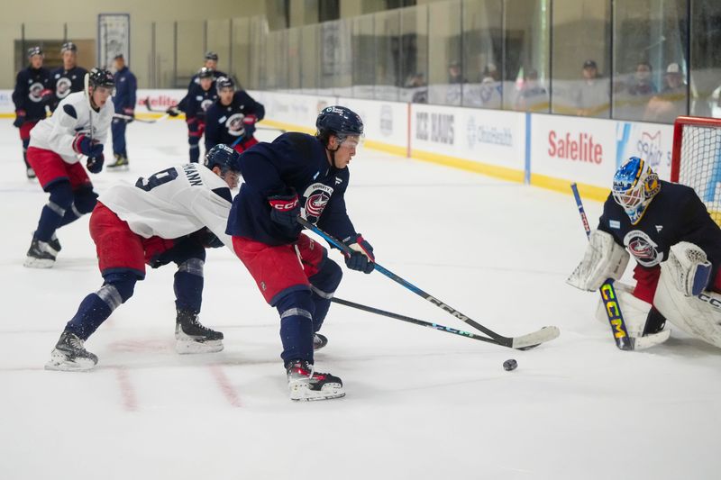 Forward Luca Pinelli (53) shoots at goaltender Evan Gardner (35) during the Columbus Blue Jackets development camp at the OhioHealth Ice Haus on July 2, 2025.
