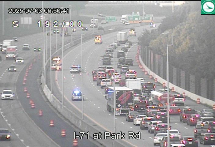 Police redirect traffic on Interstate 71 at Park Road after a crash injured three and shut down a large portion of I-71 south.