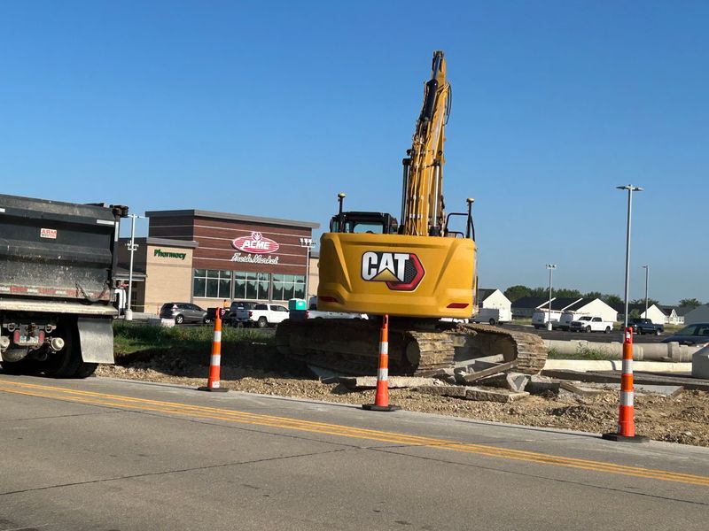 Workers are putting the finishing touches on the new Acme grocery store in Medina.