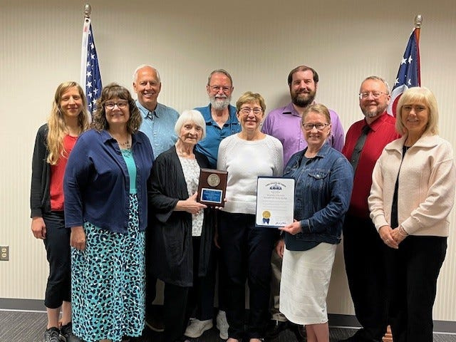 The Wayne County Board of Elections staff and board members pose with Ohio Board of the Year 2024 award and certificate the office received for the Ohio Secretary of State.