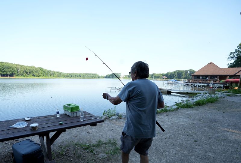 Lewis McGlothlin of Canton fishes at Sippo Lake Park East in Perry Township on a warm summer morning in July.