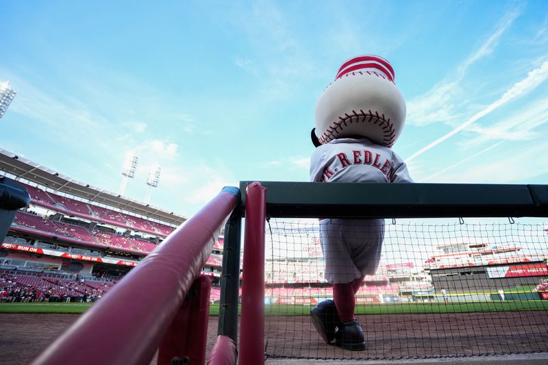 Reds mascot Mr. Redlegs leans by the dugout before their game against the Miami Marlins at Great American Ball Park on Tuesday July 8, 2025.