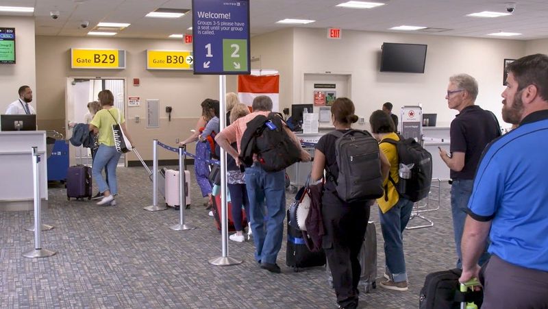 Passengers boarding a flight at John Glenn Columbus International Airport in this still photo taken from an airport file video.