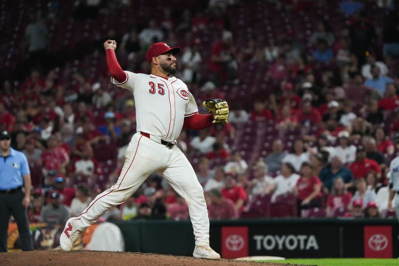 Reds catcher Jose Trevino pitches