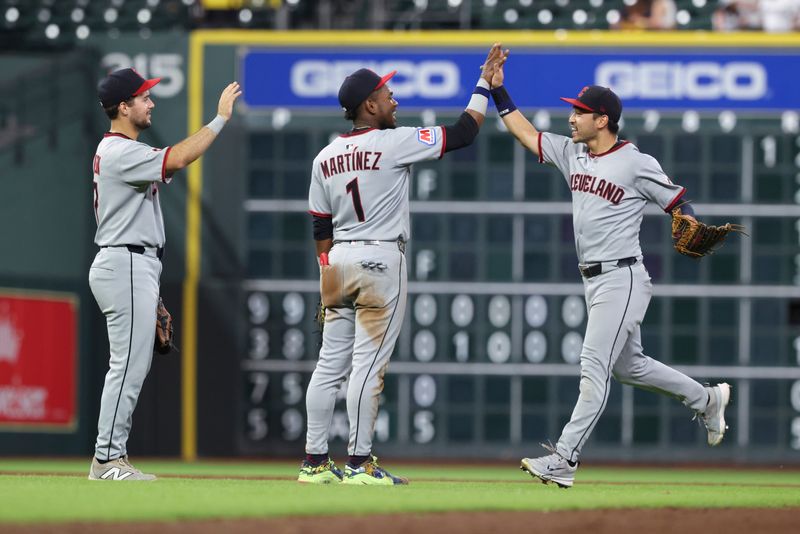 Jul 8, 2025; Houston, Texas, USA; Cleveland Guardians second baseman Angel Martinez (1) celebrates with left fielder Steven Kwan (38) after the game against the Houston Astros at Daikin Park. Mandatory Credit: Troy Taormina-Imagn Images