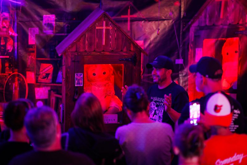 Dan Rivera, Senior Lead Investigator of the New England Society for Paranormal Research, speaks to visitors as they view the original Annabelle doll, an infamous and supposedly haunted doll which inspired 'The Conjuring' film series, on display inside of the Soldiers Orphanage Homestead as part of the 'Devils on the Run' tour, Saturday, July 12, 2025, in Gettysburg Borough.