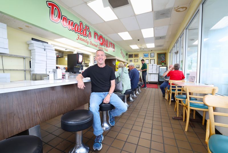 Tom Warne has worked at Donald's Donuts, started by his parents in 1960, since he was 13. He and his cousin bought the donut shop together in 2007, and Warne took over as the sole owner in 2015. Readers voted the iconic Zanesville business as the best donut shop in the country during the USA TODAY 10BEST Readers' Choice Awards in June.