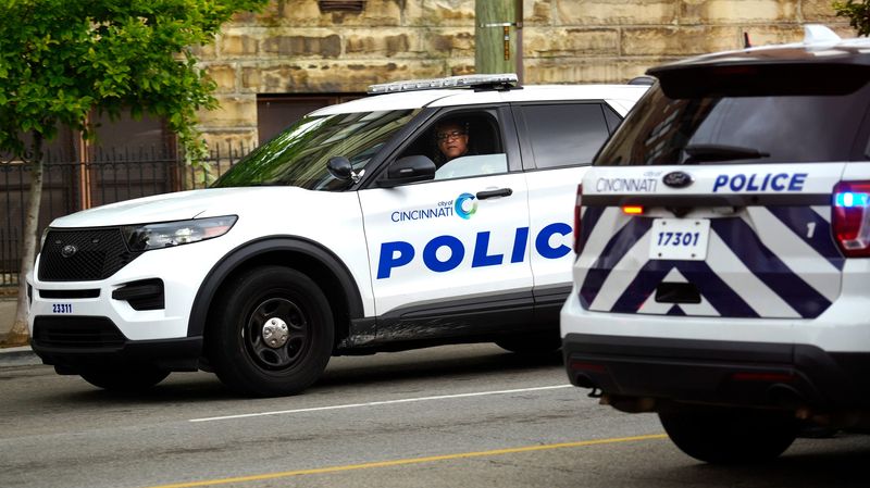Cincinnati police stop along Liberty Street in Over-the-Rhine to talk to an individual, June 30, 2025. According to census data, the city of Cincinnati covers 77.8 miles. The Cincinnati Police Department has 1,000 sworn officers.