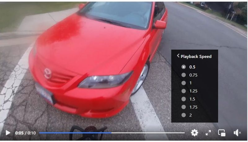This screenshot from the video posted on Facebook by the North Canton Police Department shows the handlebars of an electric bike as it is about to collide with a car on July 1.