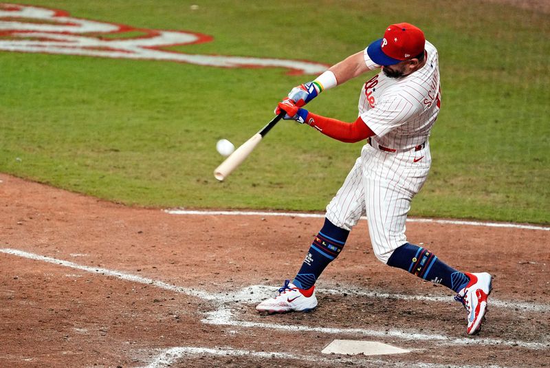 Jul 15, 2025; Cumberland, Georgia, USA; National League designated hitter Kyle Schwarber (12) of the Philadelphia Phillies hits a home run in the swing off of after the 2025 MLB All Star Game ended in a tie at Truist Park. Mandatory Credit: Dale Zanine-Imagn Images