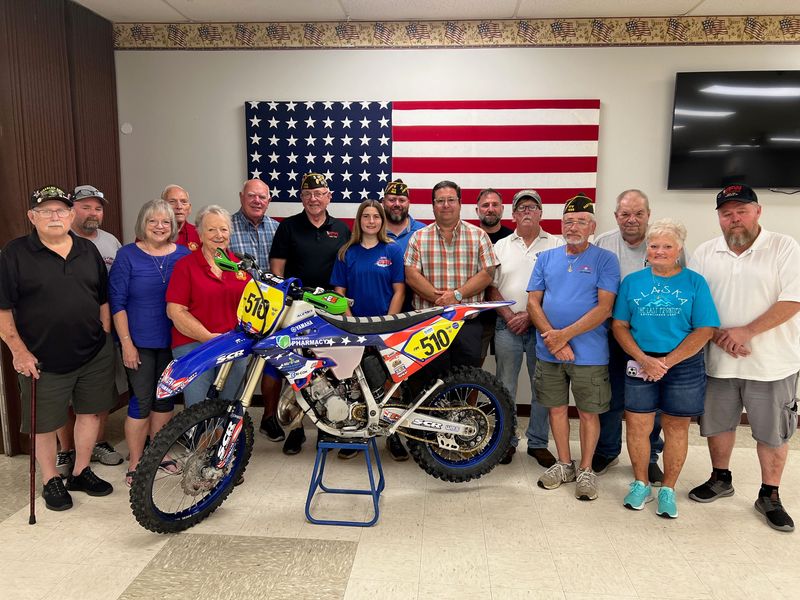 Members of Veterans of Foreign Wars Post 1058 recently made a $5,000 donation to West Muskingum student Ellie Winland, who qualified to join Team USA's club team at the International Six Days Enduro (ISDE), an Olympic-style dirt bike series in Bergamo, Italy, Aug. 24-29.