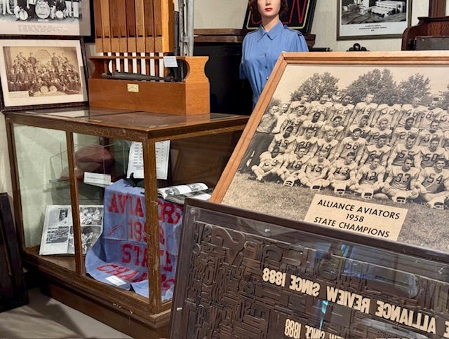 A team photo of Alliance High School’s 1958 state championship football team is displayed at Mabel Hartzell Home’s Mini Museum in Alliance.