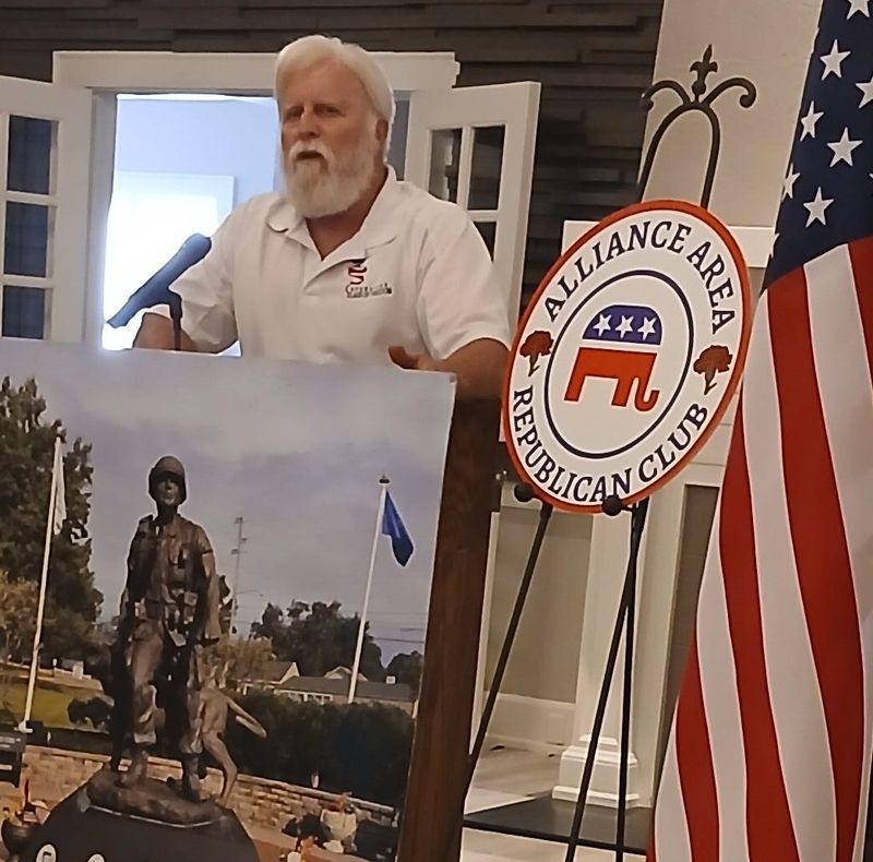 Stark Country resident Steve Toohey discusses Flags of Freedom during a meeting of the Alliance Area Republican Club at Alliance Country Club.