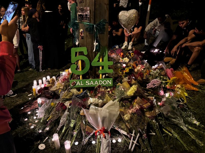 A vigil was held for Joshua Marr, 18, and Bder Al Saadon, 17, July 22 at the site of the crash that killed them on Sawmill Road two days earlier. The two were recent graduates of Dublin Scioto High School.