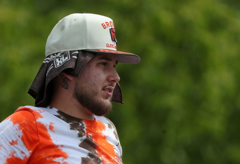 A Cleveland Browns fan watches his team during NFL training camp at CrossCountry Mortgage Campus, Friday, July 25, 2025, in Berea, Ohio.