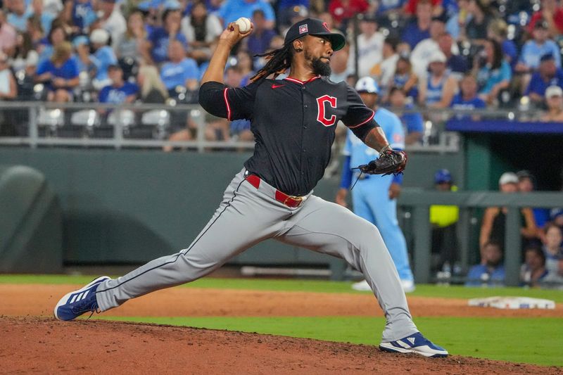 Jul 26, 2025; Kansas City, Missouri, USA; Cleveland Guardians relief pitcher Emmanuel Clase (48) delivers a pitch against the Kansas City Royals in the ninth inning at Kauffman Stadium. Mandatory Credit: Denny Medley-Imagn Images