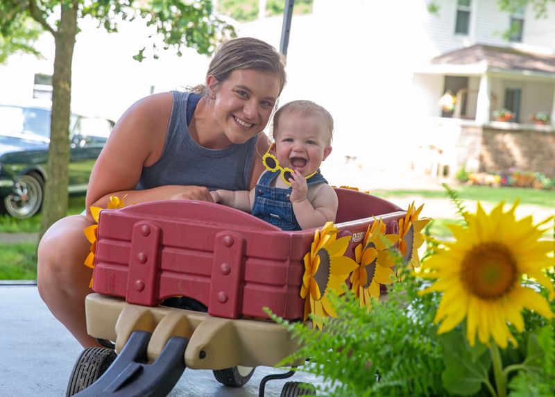 Mini Mr. Sunflower category winner Hayden Childers, 1, of Helena, competed in Lindsey Sunflower and Homecoming Festival baby contest on July 26 with the help of his mom Abby.