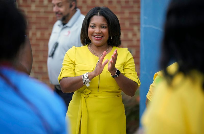 Columbus City Schools Superintendent Angela Chapman, center, along with teachers and staff welcomes kids to the first day of school on Jul 28, 2025. Woodcrest Elementary School is the district's only year-round school.