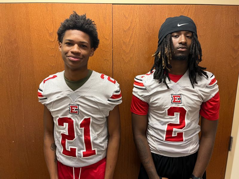 East football players Terrell Wharton Jr. (21) and Marlin Engram Jr. (2) smile at the Akron Public Schools City Series Football Media Day on Tuesday, July 29, 2025 at the Akron Education Association.