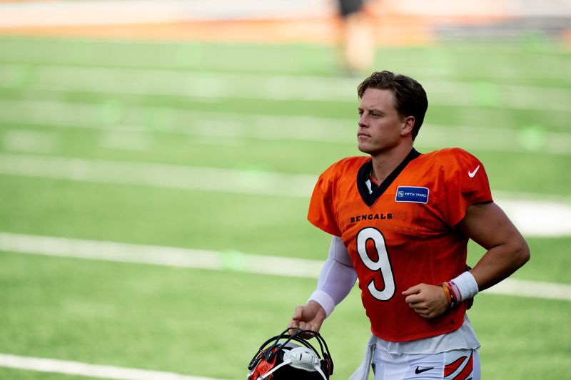 Cincinnati Bengals quarterback Joe Burrow (9) runs onto the field during Bengals Camp practice at Paycor Stadium in Cincinnati on Aug. 2, 2025.