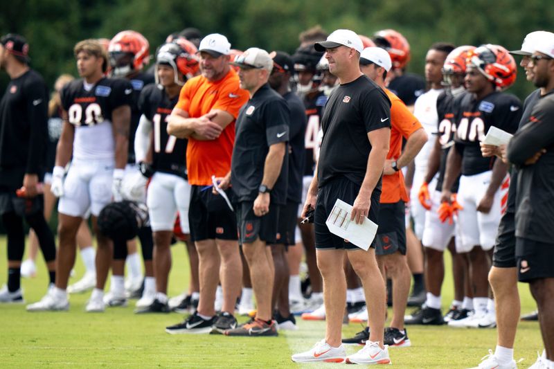 Cincinnati Bengals head coach Zac Taylor stand on the field at Cincinnati Bengals practice in Cincinnati on Tuesday, Aug. 5, 2025.