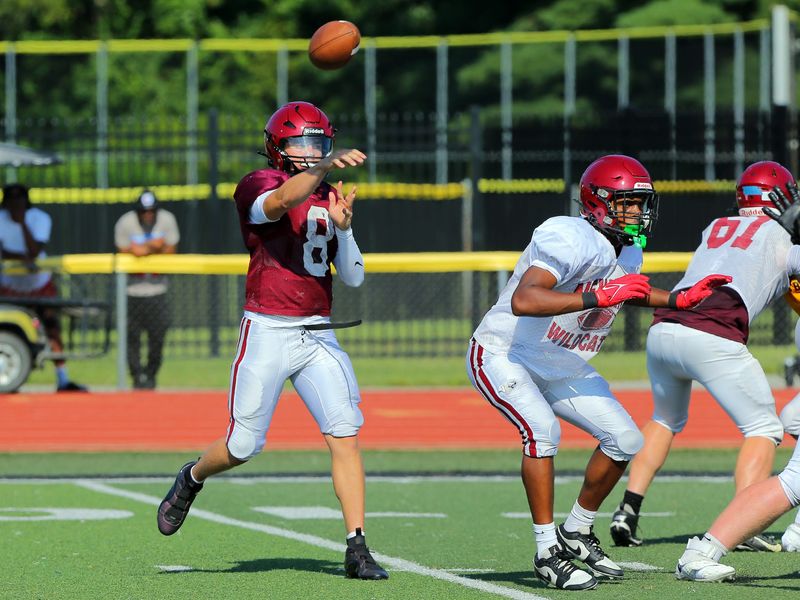 Newark quarterback Bodie Smith throws a pass against Watkins Memorial during a scrimmage on Friday, Aug. 8, 2025 at Ascena Field.