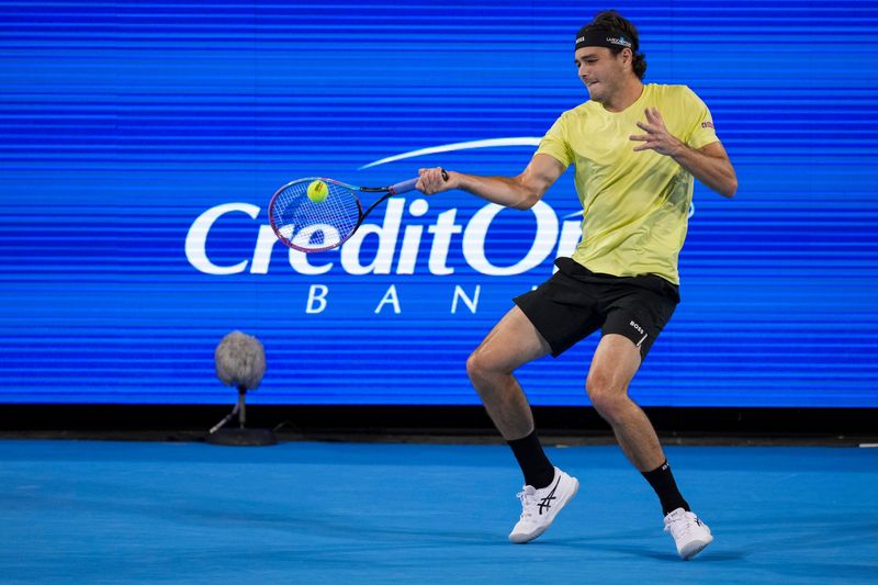 Taylor Fritz returns a shot to Emilio Nava during his 6-4, 6-4 victory on Aug. 9. Fritz is the highest rated American man at No. 4.