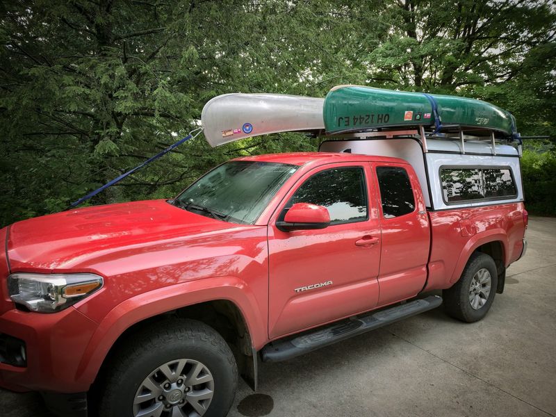 Ready to roll. Getting my tandem Grumman and solo Old Town Pack onto the truck cap was a breeze with my improvised rollers. I removed the end rollers on the driver's side because they weren't needed for the lightweight solo boat. They're stashed inside the cap and can easily be put back on for hauling heavier tandem canoes side by side.