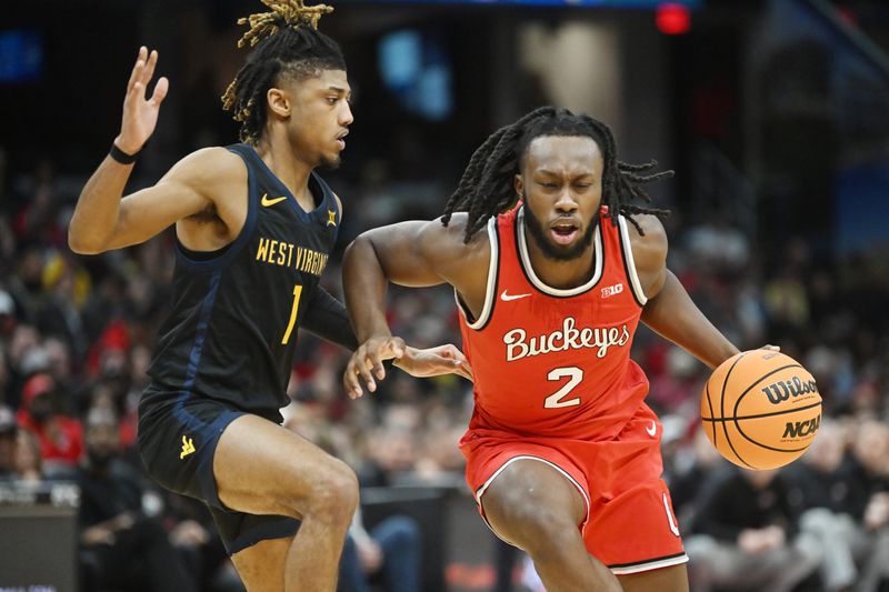 Dec 30, 2023; Cleveland, Ohio, USA; Ohio State Buckeyes guard Bruce Thornton (2) drives to the basket against West Virginia Mountaineers guard Noah Farrakhan (1) during the first half at Rocket Mortgage FieldHouse. Mandatory Credit: Ken Blaze-USA TODAY Sports