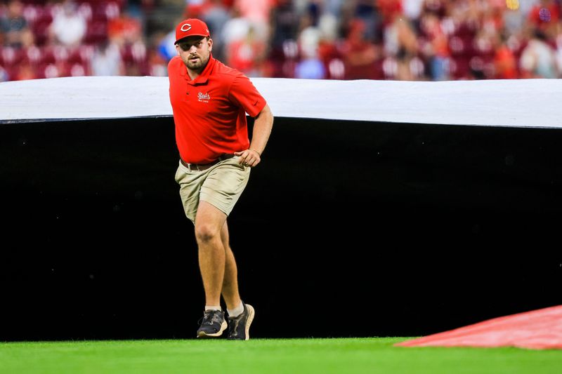 The Cincinnati Reds and St. Louis Cardinals entered a rain delay on May 24. Pictured is a member of the Great American Ball Park grounds crew tending to the field during an Aug. 12, 2025 game.