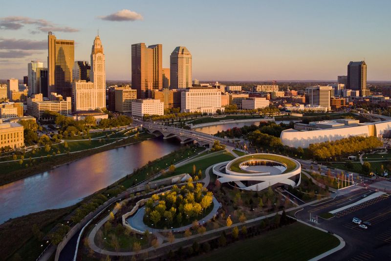 With the Columbus skyline as a backdrop, the sunset lights up the new National Veterans Memorial and Museum on Oct. 17, 2018. Columbus' newest tourist destination is set to open on Oct. 27.