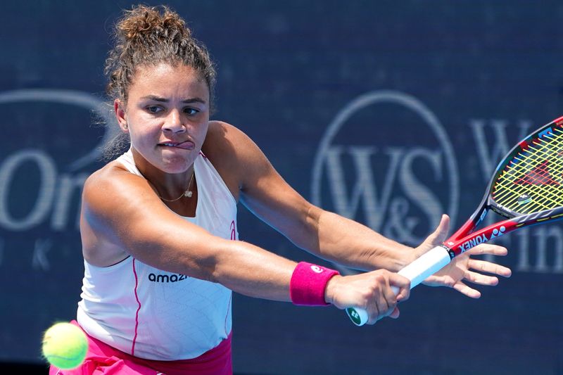 Jasmine Paolini returns a serve to Barbora Krejcikova in the Cincinnati Open fourth round match between Jasmine Paolini and Barbora Krejcikova, Thursday, Aug. 14, 2025, at the Lindner Family Tennis Center in Mason. Paolini won 6-1, 6-2.