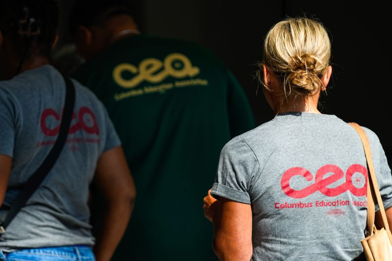 Members of the Columbus Education Association check in at the Columbus Convention Center to vote on a contract with Columbus City Schools on Thursday, Aug. 14, 2025 in Columbus, Ohio.