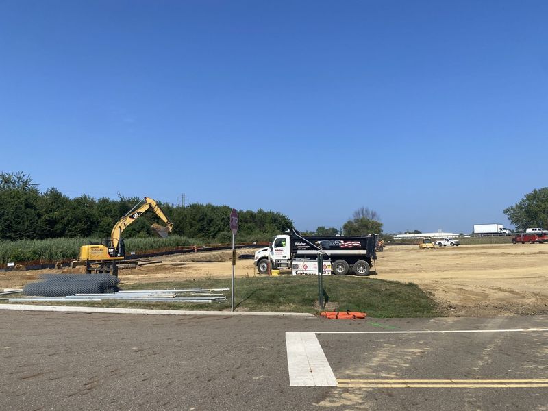 Excavators begin moving dirt at the site of the future employee parking lot to make room for the Stark County Jail addition. August 15, 2025.